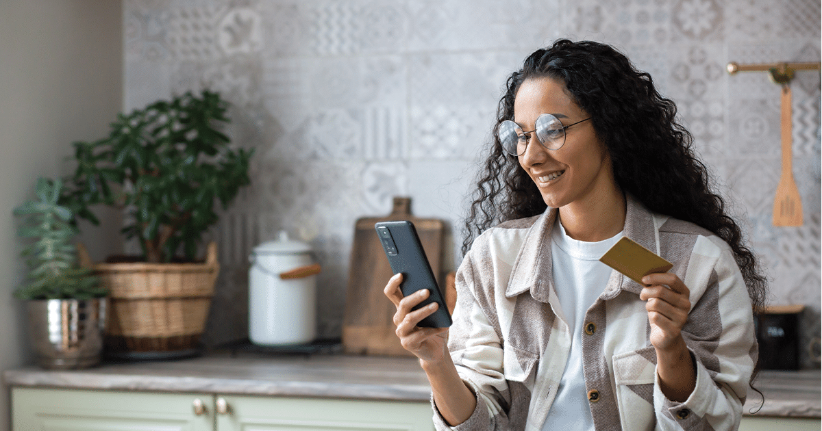 woman looks at customer loyalty tools on phone