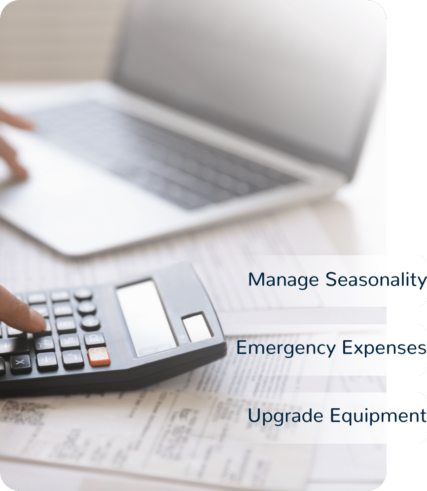 Person on laptop and calculator, words say manage seasonality, emergency expenses, and upgrade equiptment